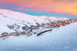 Les Menuires in a gorgeous pink glow at sunrise